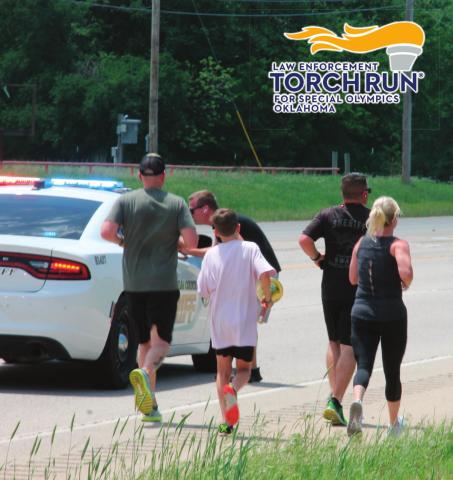 One officer passes the torch