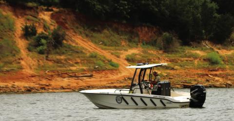Trooper Ryan Griffith of the OHP’s Marine Division patrols the Cimarron Arm of Keystone Lake near Appalachia Bay Recreation Area Friday. Griffith was among the first to respond to July 4’s double drowning at Keystone. Photo by J.D. Meisner
