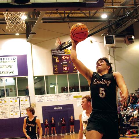 Johnny Hilligoss charges in for a layup.