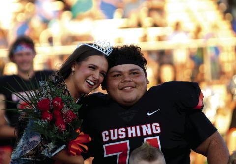 Cushing Homecoming Queen Georgia Griffeth and King Nicholas “Panda” Flores enjoy their moment during homecoming festivities held Friday, prior to the Tiger’s rout of Berryhill, at O’Dell Field. Photo by J. D. Meisner