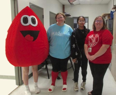 Obi, the blood drop, alongside STUCO members Averi Todd and Lily Haines with their sponsor Lacey Haines. Obi was escorted around Drumright by STUCO member Torin Bray.