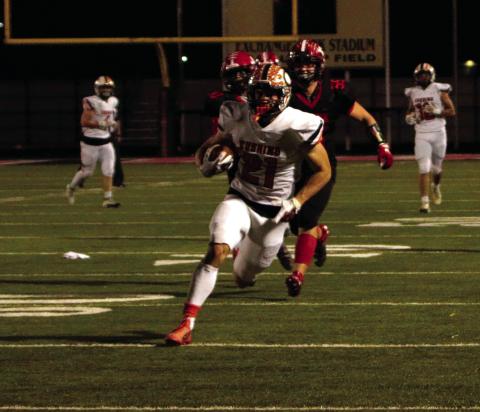 Senior Camden Crooks returns a punt for a touchdown Friday.
