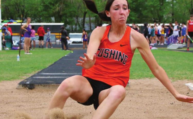 Kamryn James shows winning form in the long jump.