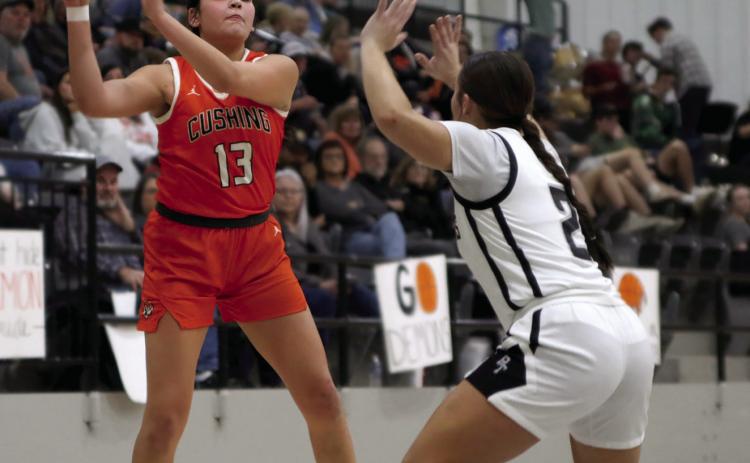 Ella Nanaeto fires a pass inside against the Perkins-Tryon lady Demons last week. Photo by Amber Fausto