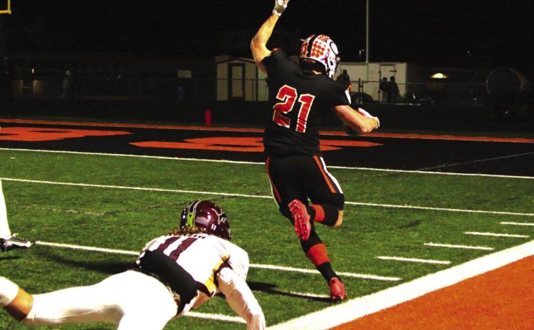 Senior Camden Crooks keeps his balance and stays in bounds during a 30- yard scamper into the endzone.