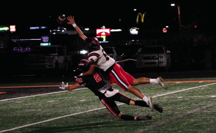 This is what interference looks like as Hilldale free safety Aidan Lindquist takes a ride on the back of Cushing receiver Jordan Kersey. Photo by J. D. Meisner