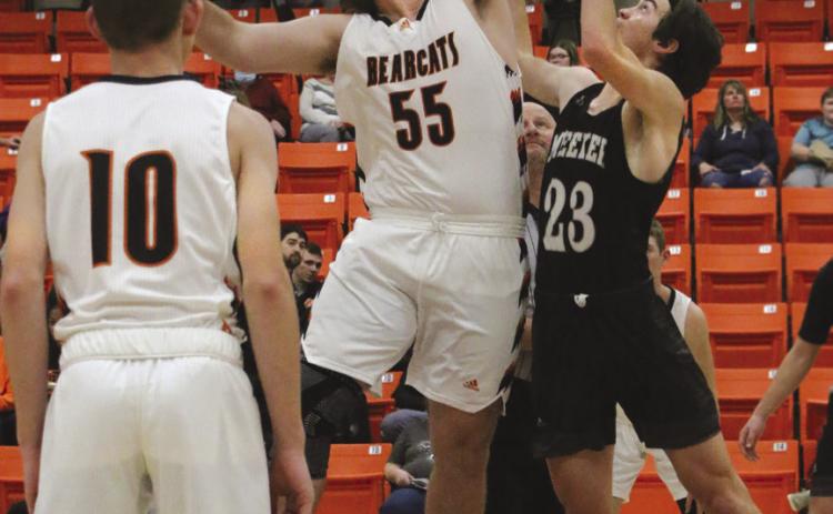 Agra Bearcat Bryson Howard wins the tip off agains Meeker Bulldog Ean Watham Bearcats game against the Dawgs during the Agra invitation tournament Friday, Dec. 9.