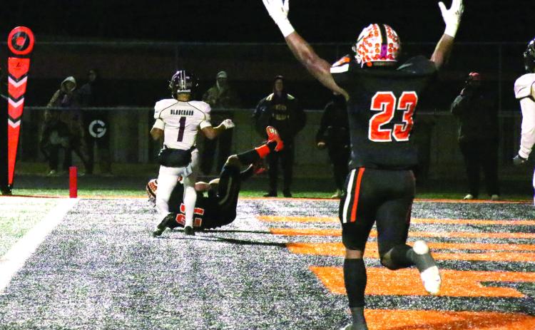 Senior running back Noah Jones celebrates as wide receiver Camden Crooks rolls in with a touchdown during the Tigers’ Friday night win over Blanchard. Cushing advanced to the semi finals and will play the Elk City Elks Friday, at 7 p.m., at the Putnam City High School stadium in Oklahoma City. Photo by Allie Prater. See story inside.