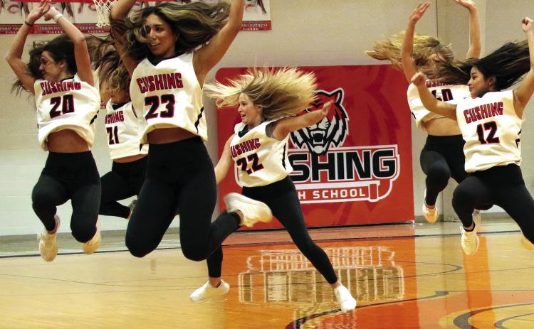 Members off the CHS Tiger dance team catch air as they perform during half time of the Lady Tigers game against the Bristow Pirates, Friday. Photo by J. D. Meisner