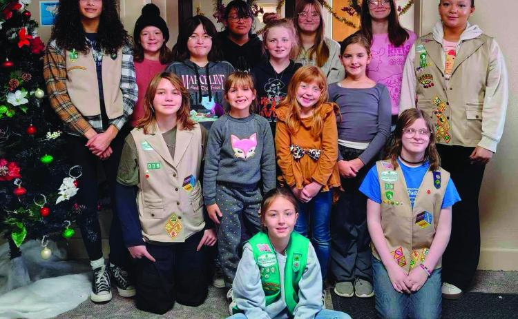 Troop #79 stand together after working diligently to spread Christmas cheer by decorating the Cushing Marketplace. Pictured: back row (L to R): Audrey Roberson, Sadie Maxwell, Tegan Fincher, Arhyanna Tusler, Willow Keyes. Middle row (L to R): Brooklynn Pierce, Teagan Williams, Addilyn Fox, Alexa Page. 3rd row (L to R): Addison Kidder, Mia Fox, Cora Doak, Alice Green. Front: Everley Ewy. Photo courtesy of Laura Green.