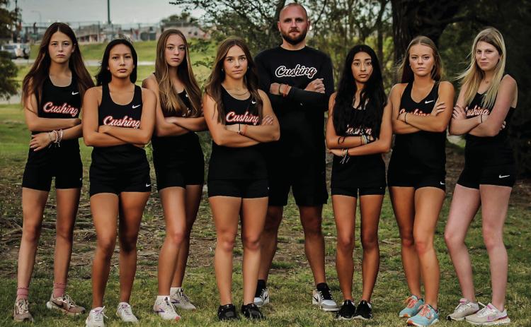 The Lady Tigers tied a school record with their 13th-place finish and Amaya Grant finished third. Pictured are: Grant, Morgan Franklin, Emory Eyler, Melannie Townes, Head Coach Josh Greer, Yohali Medrano, Cora Eyler and Brooklyn Burden. Photos by Sarah Townes