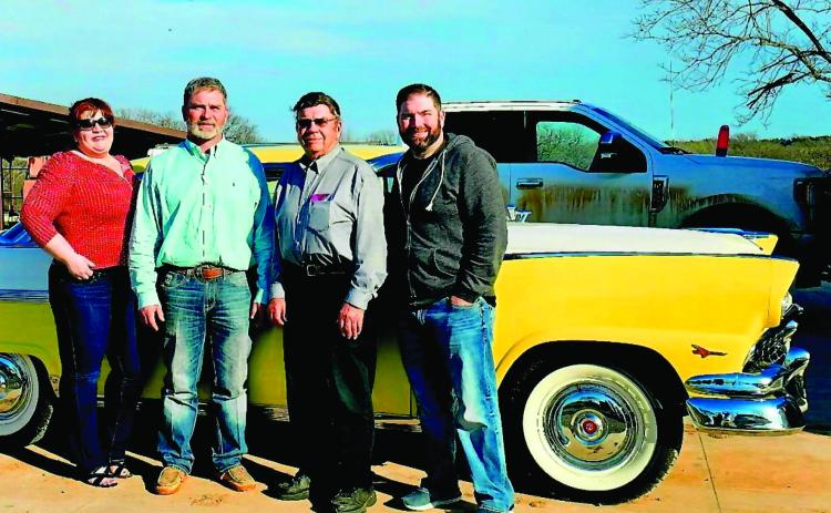 NIkki, Bret, Brad and their father Les White stand in front of the 1956 Ford Crown Victoria the kids presented to him earlier this month.