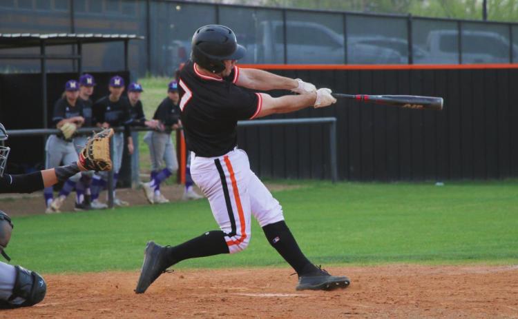 Riley Matheson sends a solo shot over the centerfield fence against Mannford last Thursday. Photos by Allie Prater