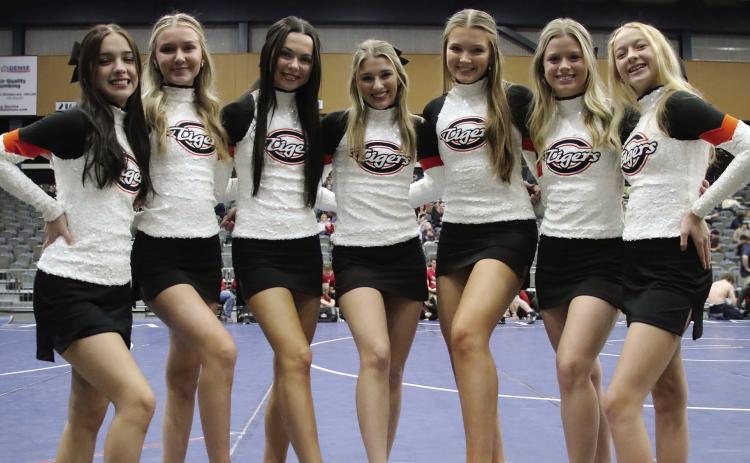 Cushing Cheerleaders Ellie Andrews, Gracie Hickman, Anna Mae Nighswonger, Ava Babinec, Brittan Blakemore, Presley Elliott, and Anisten Campbell at the 2024 Dual State Wrestling tournament Friday, Feb. 9. Photo by Allie Prater