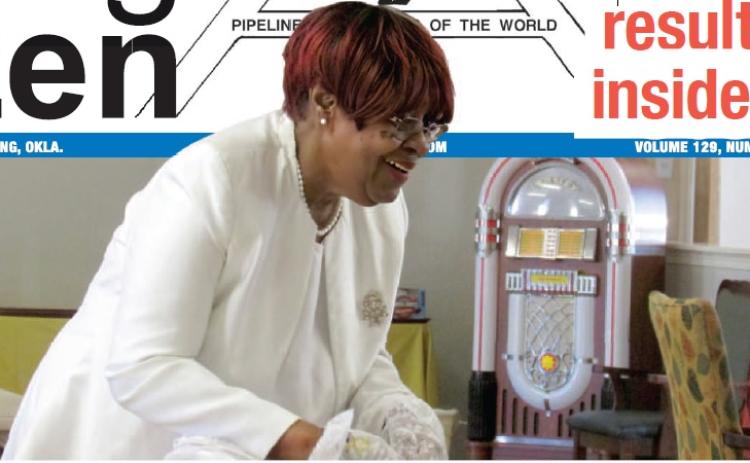 Worthy Matron of Chapter #48 Lady Talliaferro branch of the Order of the Eastern Star Lynda McPheters shares the love with Linwood Village residents by passing out socks with hearts in her OES uniform — white clothes, pearls, fl owers, and gloves with the OES emblem — on Valentine's Day last week. Photo by DeAnna Maddox.