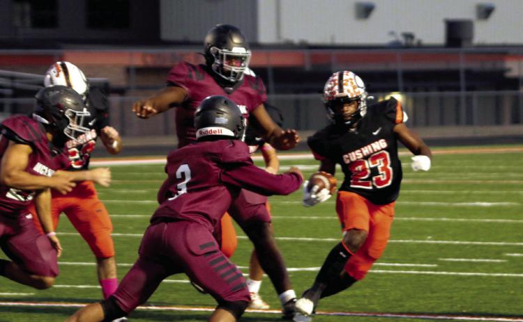 Runningback Noah Jones hits the brakes in an effort to shrug off a McClain defender Friday. Jones had 72 yards on 11 carries and scored two touchdowns. Photos by J.D. Meisner.