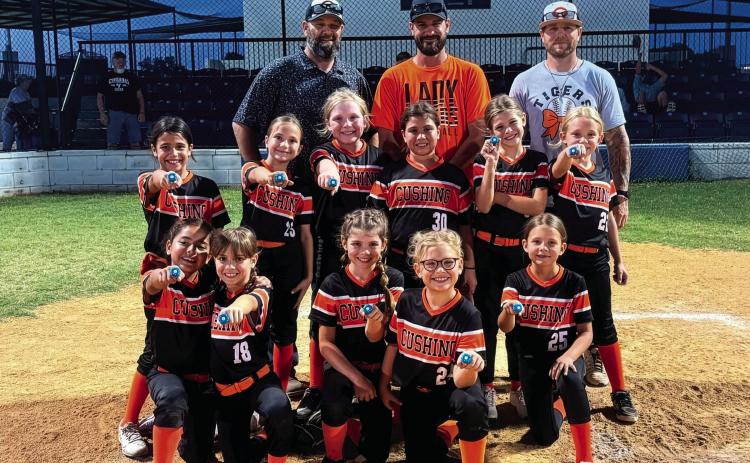 The Cushing Lady Tiger 8U softball team finished the season with an impressive 13-4 record and earned runner-up honors in the end-of-season tournament. They are, back row from left, Erik Brown, Jacob Westmoreland and Dustin Kelly. Middle row from left, Malia Rockwell, Kannyn Brown, Hadley Morgan, Athena Ka’ne, Gentry Westmoreland and Clare Delong. Front row from left, Ivette Cruz, Mia Fox, Taya Kelly, Reese Laurdale and Loxi Busby.