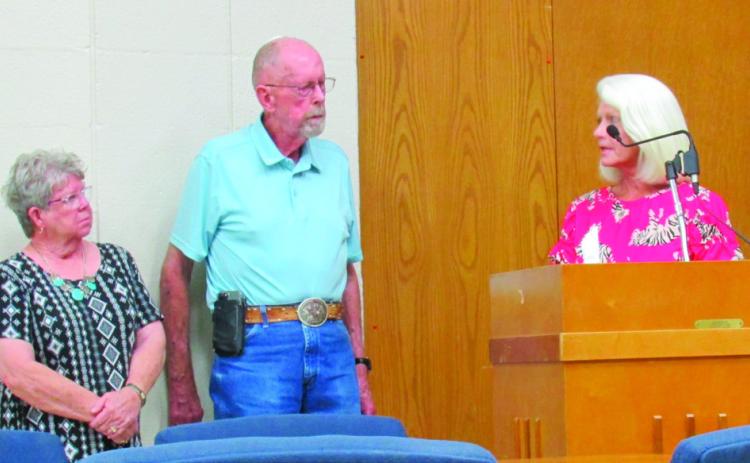 Breast cancer survivor Pam Hawthorne and CHF Chairman Roy Lee Kalka listens as Commissioner Nancy Dowell, whose mother was a breast cancer survivor, accepts a donation on behalf of the CHA. The funds will go towards the purchase of a 3D mammogram machine for the hospital.