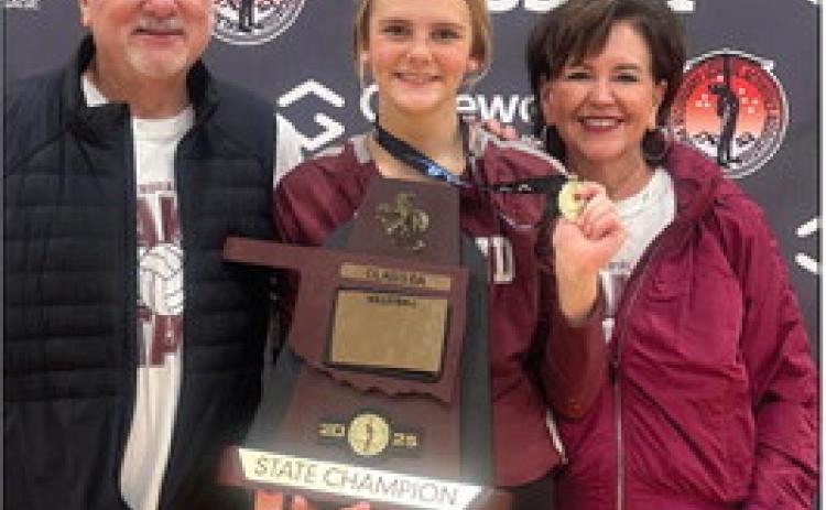 Bill and Jo Ahrberg stand with their granddaughter, Edmond Memorial Freshman Audrey-Kate Bajema, after she and her team captured the OSSAA Class 6A state volleyball title last month.