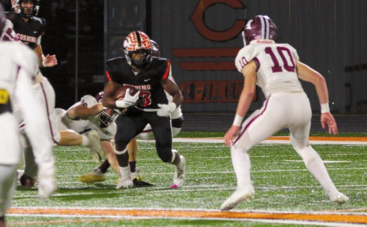 Cushing running back Noah Jones sets a defender up for an ankle break. Jones rushed for 121 yards and two touchdowns Friday during the Tigers’ 63-14 win over Ada.