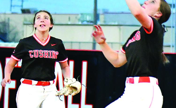 Macy Griffith handles an infield fly at first base for the 16thranked, 10-9, Lady Tigers while Laramie McCoy backs her up. Photos by Sarah Townes