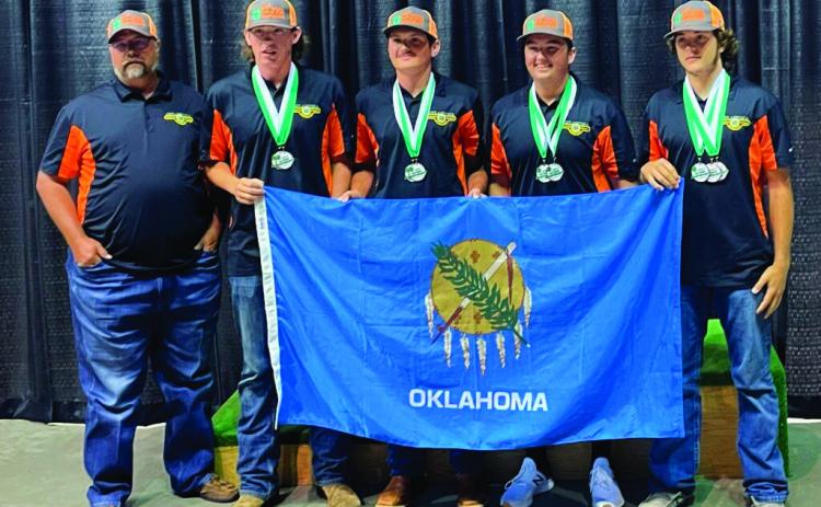 From left to right: Coach Dewayne Skidgel, Alexander Palmer, Tanner Moles, Evan Beck and Tagun Fittje.
