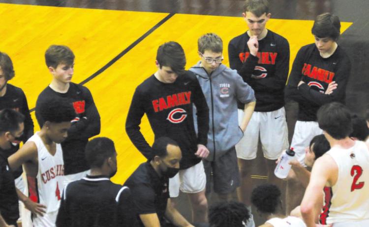 Above: Tiger Head Coach Jonteau Ezell maps out an inbound play during a late game timeout during the Cushing game against Bristow last Friday, Feb. 5. The Tigers fell to the Bristow Pirates 43-45.