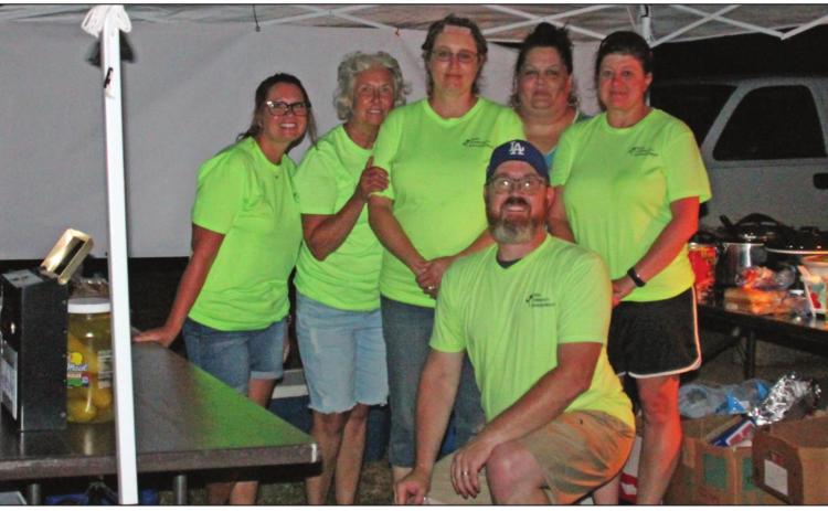 Members of ACE at the concession during outdoor movie night in Agra. Brandi Gladden, Brenda Bottger, Becky Seller, Laura Brown, Kimberly Sweet, and Justin Brown