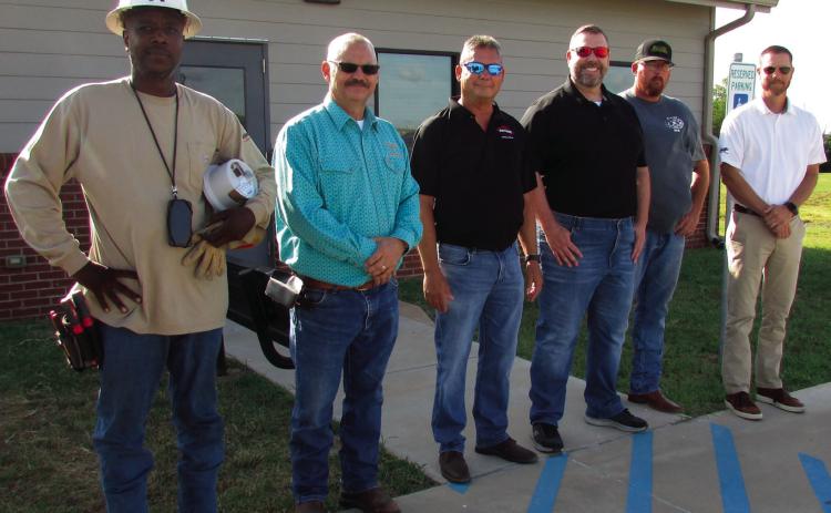 The AMI team stands together as they prepare for the first installation at the Cushing Animal Shelter. Pictured are Allegiant Utility Services install tech Quan Pugh, City of Cushing Electrical Superintendent Mike Stark, TESCO-Nighthawk Regional Manager Kevin Farrell, TESCO-Nighthawk member Jon Scott, TESCO-Nighthawk Senior Field Tech Billy Hennig, and Assistant City Manager Derek Griffith. Installs will be happening throughout the City over the next several weeks. Photo by DeAnna Maddox