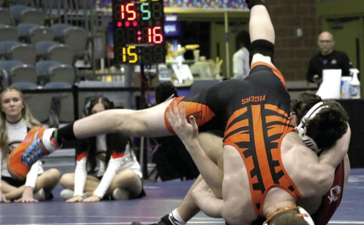 Cushing wrestler Iziah Tusler flips over Tuttle Tiger Rylend Slover during the championship match at the OSSAA Dual State Tournament held Friday, Feb. 9. Tusler won over Slover by decision 9-4. Photos by Allie Prater.
