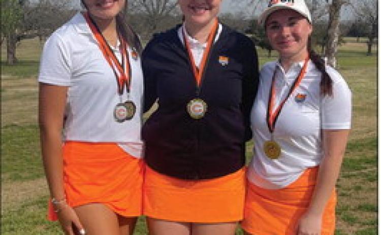 Lady Tigers Addisyn Fields, Ayla Britt, and Ashlyn Floyd stand together after the tournament. All three ladies placed in the top 10. Photo by Dena Floyd.