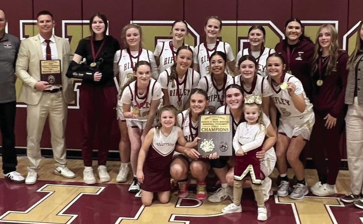 The Ripley Lady Warriors stand with their first place plaque after winning the Ripley tournament last week. The Lady Warriors beat Glencoe 41-14, Crossings Christian 54-17, and Prague 46-38.