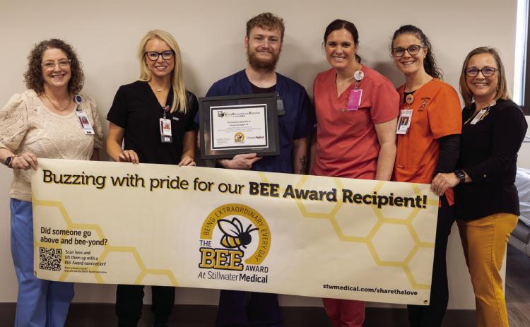 From left: Mary Beth Hunziker, Kelsey Hancock, award recipient Russell Goodgion, Alexis Gribbon, Chelsea Engle, and Deborah Aguilar, all members of the BEE committee.