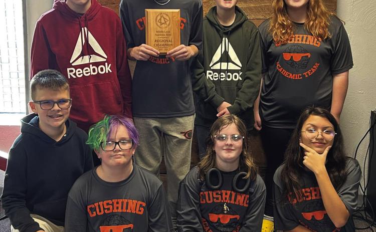 Last week Cushing Middle School Academic Team competed in Regionals and won. Pictured is the team with the plaque they received following the competition. Courtesy of Cushing Public Schools