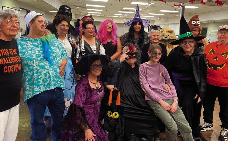 Visitors of the Cushing Senior Citizens Center enjoy Halloween festivities.