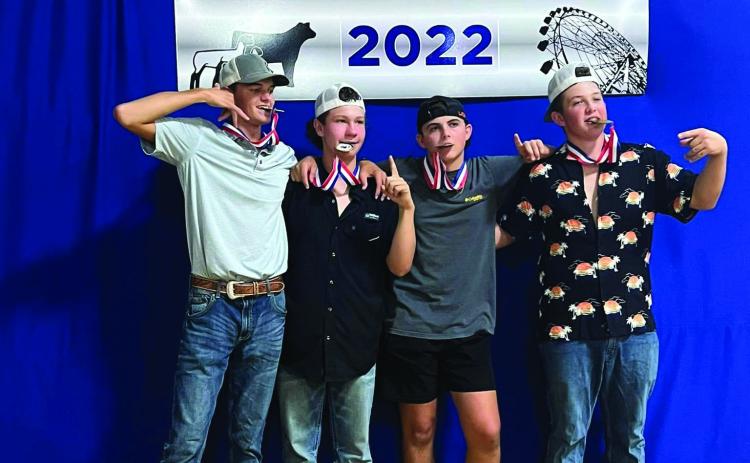 Pictured are the Cushing FFA members who took home first place in the Farmhand Olympics during the Payne County Fair held last week from Aug. 22 to Aug. 27— Khyler Simon, Clay McKiddy, Kale Robinson and Korben Gaskins