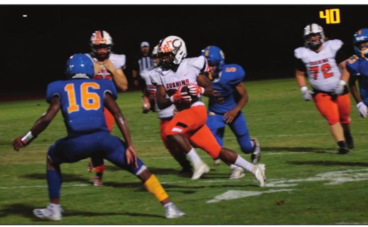 Tiger speedster Noah Jones slices through Classes linebackers on his way to a 100-plus yard running game.