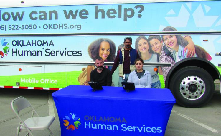 Family Services Specialists Howard Smith, Naveen Nair, and Yesenia Ramirez wait for clients in the parking lot of the Cushing Senior Citizen Center last Wednesday on April 24. The group will be offering OKDHS assistance to local clients the fourth Wednesday of every month from 9 a.m. to 4 p.m. Photo by DeAnna Maddox