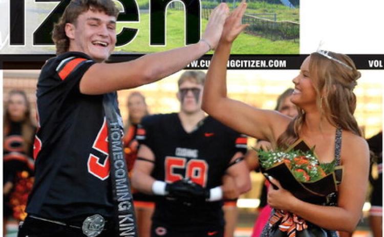 Freshly crowned Homecoming King Justice Elliott and Queen Brinlee Bickell exchange a high-five moments after assuming the throne Friday at O’Dell Field. Early reports indicate the transfer of power was mostly peaceful unless you ask the Miami Wardogs, who went home with their tails tucked after a 42-13 loss. Photo by J. D. Meisner