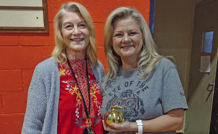 Agra Public School’s third grade teacher Vickie Weigel was announced as the 2025 District Teacher of the Year during the monthly assembly held on Monday, May 5. Pictured is Superintendent Dr. Anita Watkins with Weigel holding the golden apple she was presented with. Watkins explained Weigel was selected by her peers to receive the recognition. Photo by DeAnna Maddox