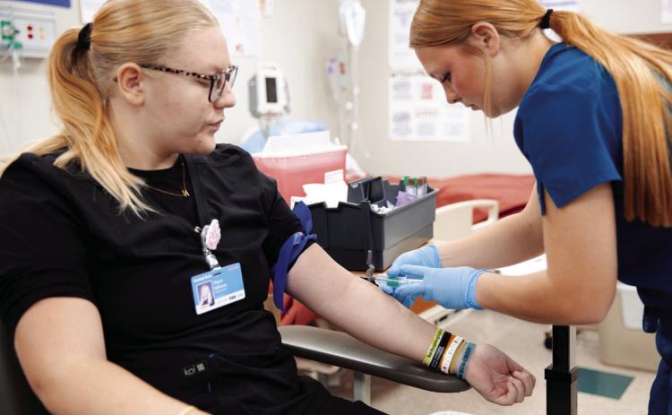 An Advanced Health Careers student at Central Tech practices.