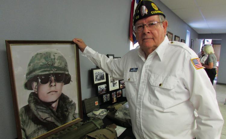 Vietnam Vet Jim James shows some of the memorabilia he acquired on his tour during the Vietnam War. Photo by DeAnna Maddox