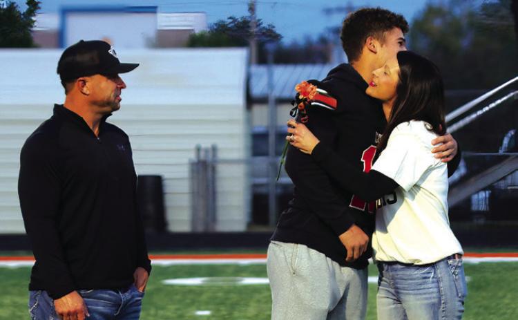 Football Player Brock Bales, the son of Curtis and Dusty Bales; a teacher who has impacted Brock is his mom, Mrs. Bales.