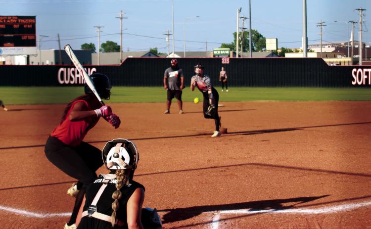 Lady Tiger Pitcher Macy Griffith delivers the heat during the Cushing Lady Tigers’ showcase Orange and Black scrimmage last Thursday. The Lady Tigers went 9-18 last season and reached the second round of the regional tournament. Photo by J. D. Meisner