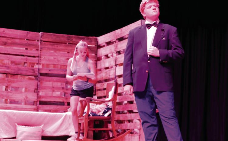 Juniors Macie Townes and Kyson Meador share the stage during a rehearsal of the one-act play “The Miraculous Journey of Edward Tulane”. Townes was playing the part of Abilene Tulane, the adoring young girl who was first gifted the title character Edward Tulane — a china rabbit voiced by Meador.