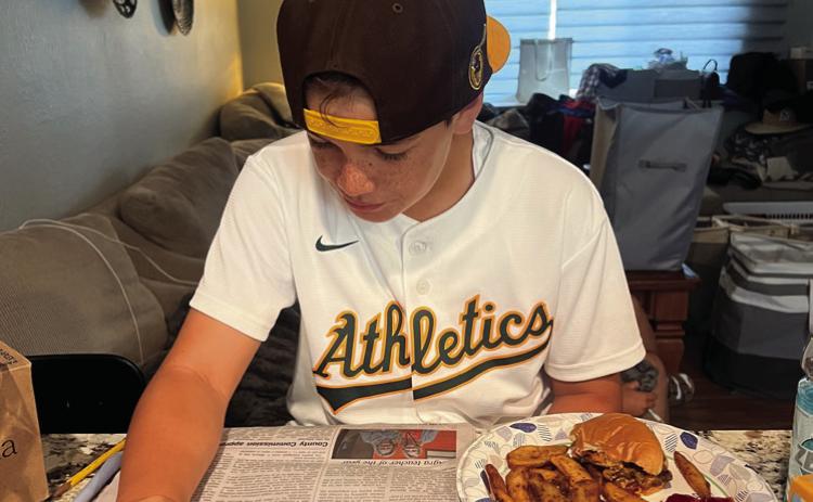 Roland Williams, 10, of Roseville, CA, reads the Cushing Citizen as he eats his lunch. Share with us on Facebook how you read your Cushing Citizen!