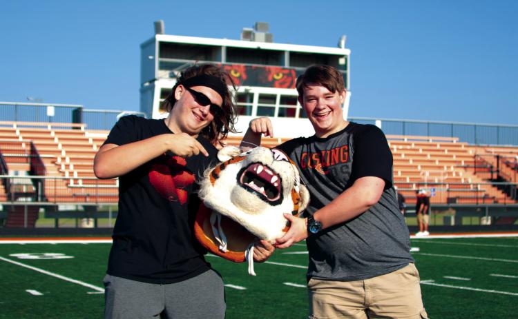 Dawson Claxton and T. J. Jenkins mug with Tony at Cushing High School’s football media days. The Tigers open their season at home on Friday, Sept. 2, against Bristow.