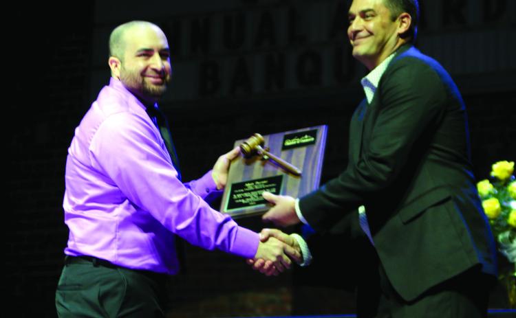 Nick Naifeh, incoming President of the Cushing Chamber of Commerce Board for Directors shakes hands with Matt Turner, outgoing president.