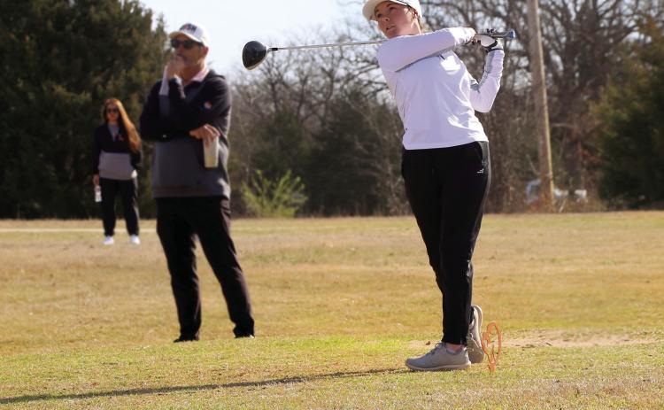 Lady Tiger sophomore Ashlyn Floyd hits a drive to the green during Monday’s tournament. Photo by Allie Prater.