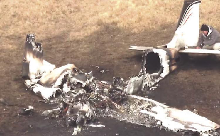 1971 Beechcraft Bonanza wreckage after emergency crews extinguished the fire. Aerial photo courtesy KFOR News.